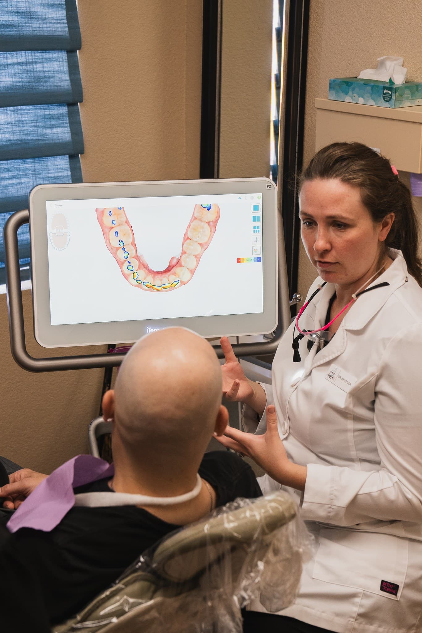 Dr. Kayla Keppler reviews a patient's digital scan at J Street Dental Group, where we plan dental implants in Sacramento